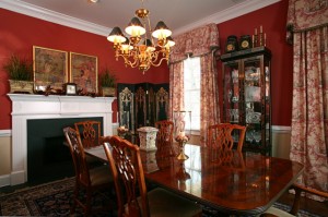 Photo by Scott Smallin - traditional dining room Traditional Dining Room with Chinese Toile fabric, Devine Toile brick red paint color